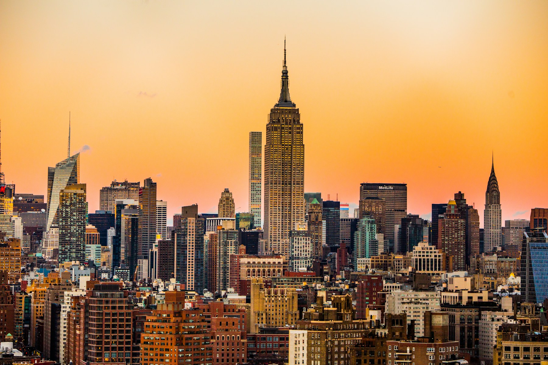 Midtown Manhattan skyline with the Empire State Building at sunset