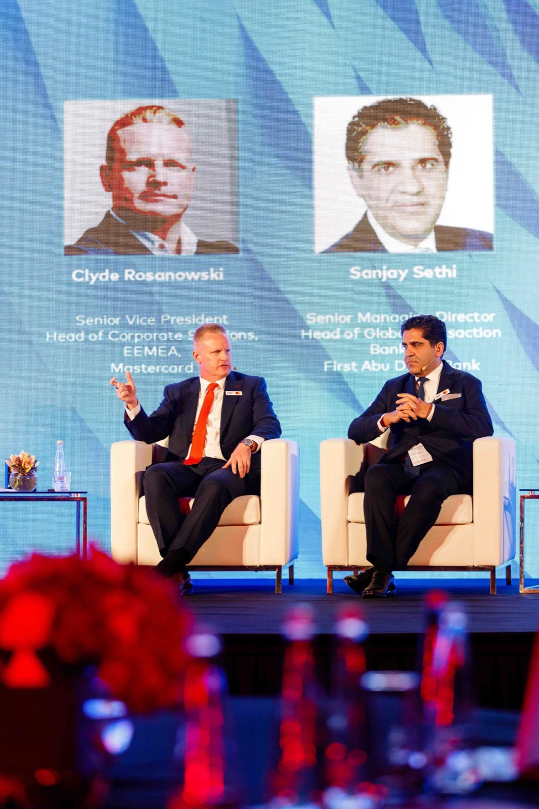 Clyde Rosanowski speaking alongside a banking leader at a First Abu Dhabi Bank event